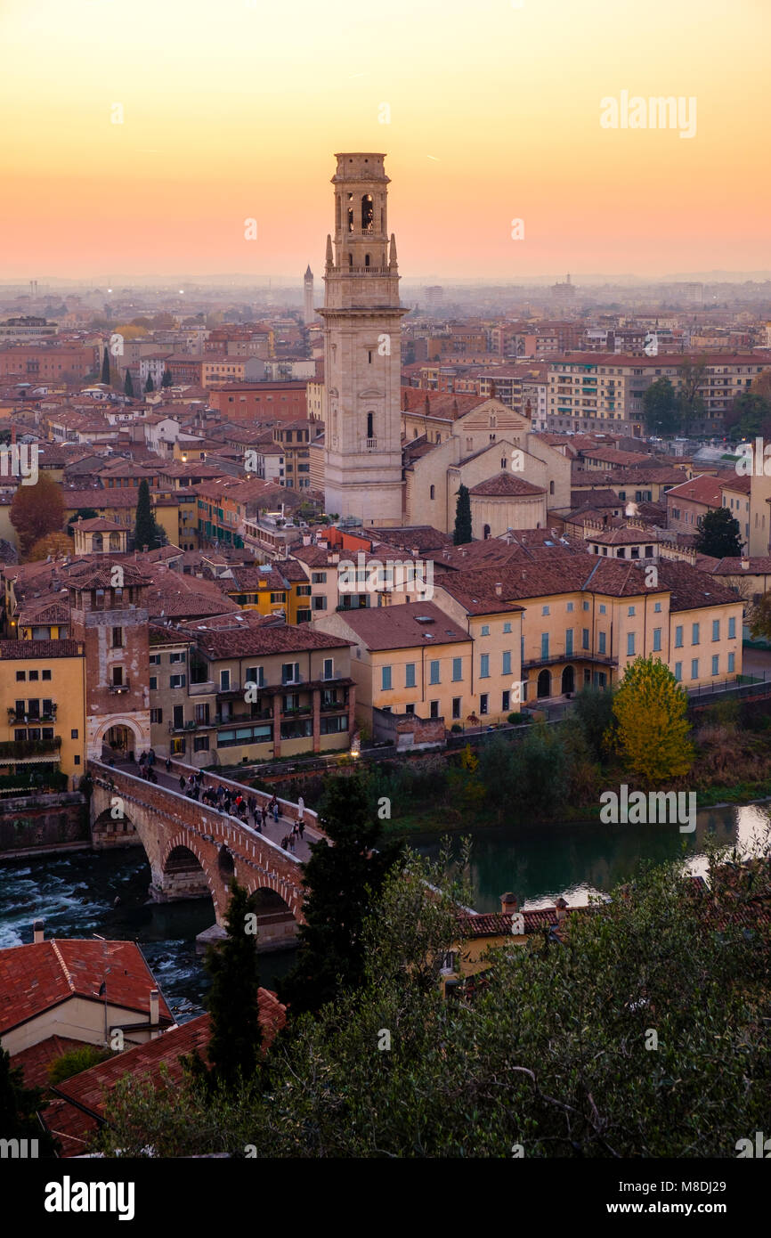 View of Verona city with Ponte Pietra and the river Adige at sunset.Italy. Stock Photo