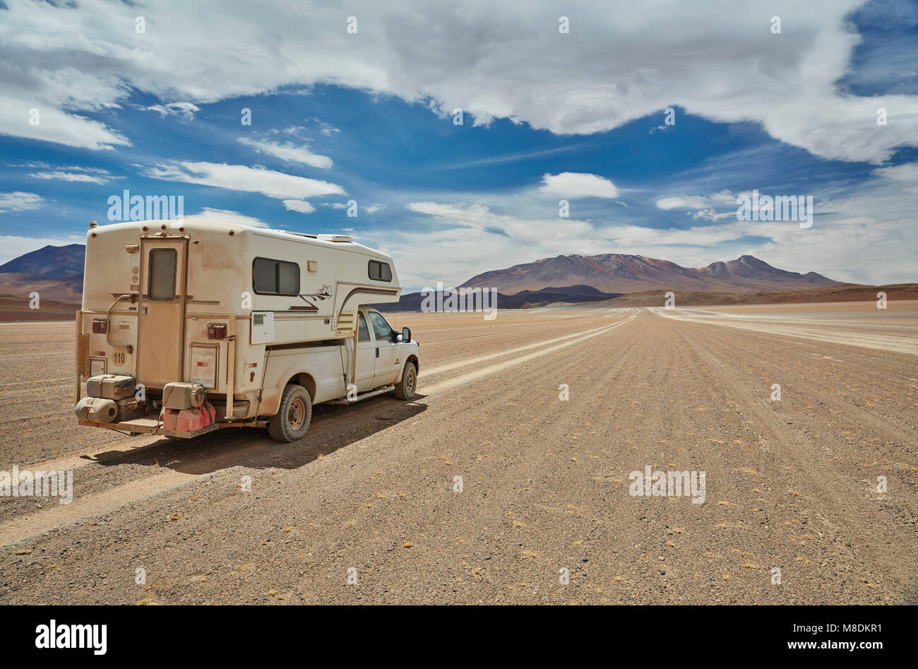 Recreational vehicle, travelling across landscape, rear view, Villa Alota, Potosi, Bolivia, South America Stock Photo