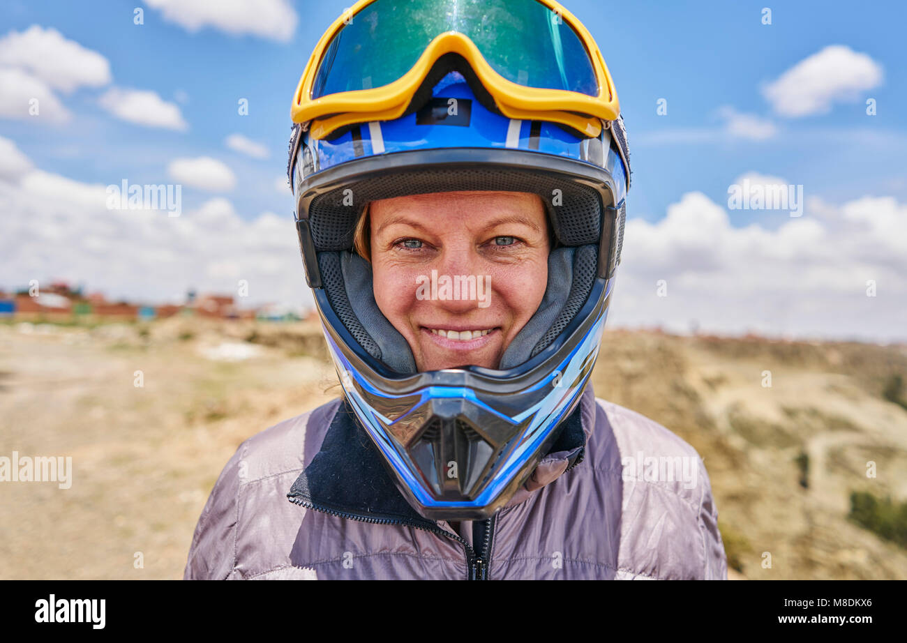 Portrait of woman wearing crash helmet, close-up, La Paz, Bolivia, South America Stock Photo