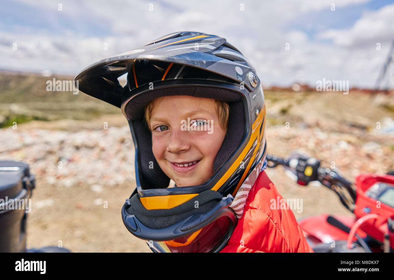 Portrait of boy wearing crash helmet, close-up, La Paz, Bolivia, South America Stock Photo