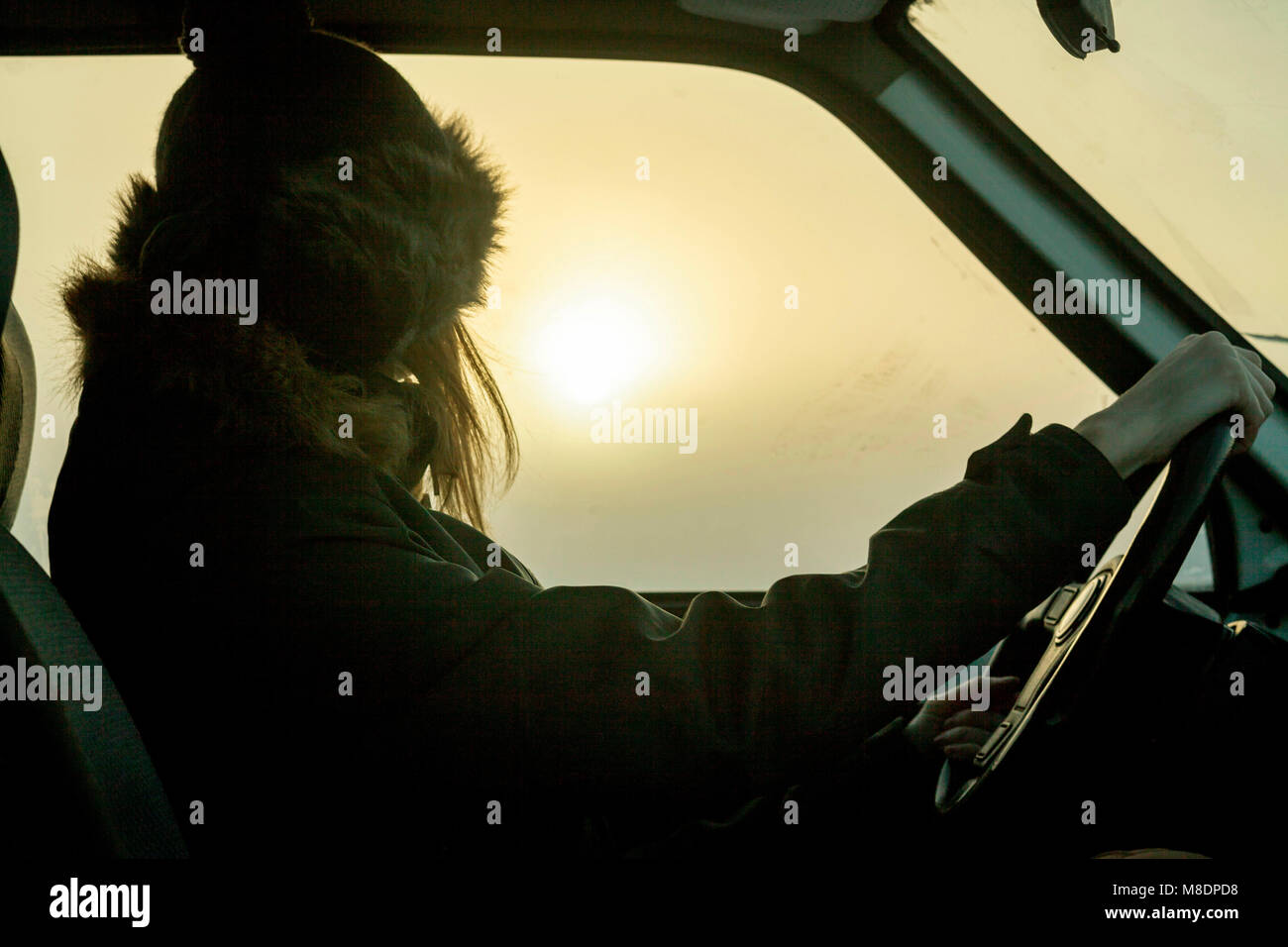 Woman behind wheel of car Stock Photo