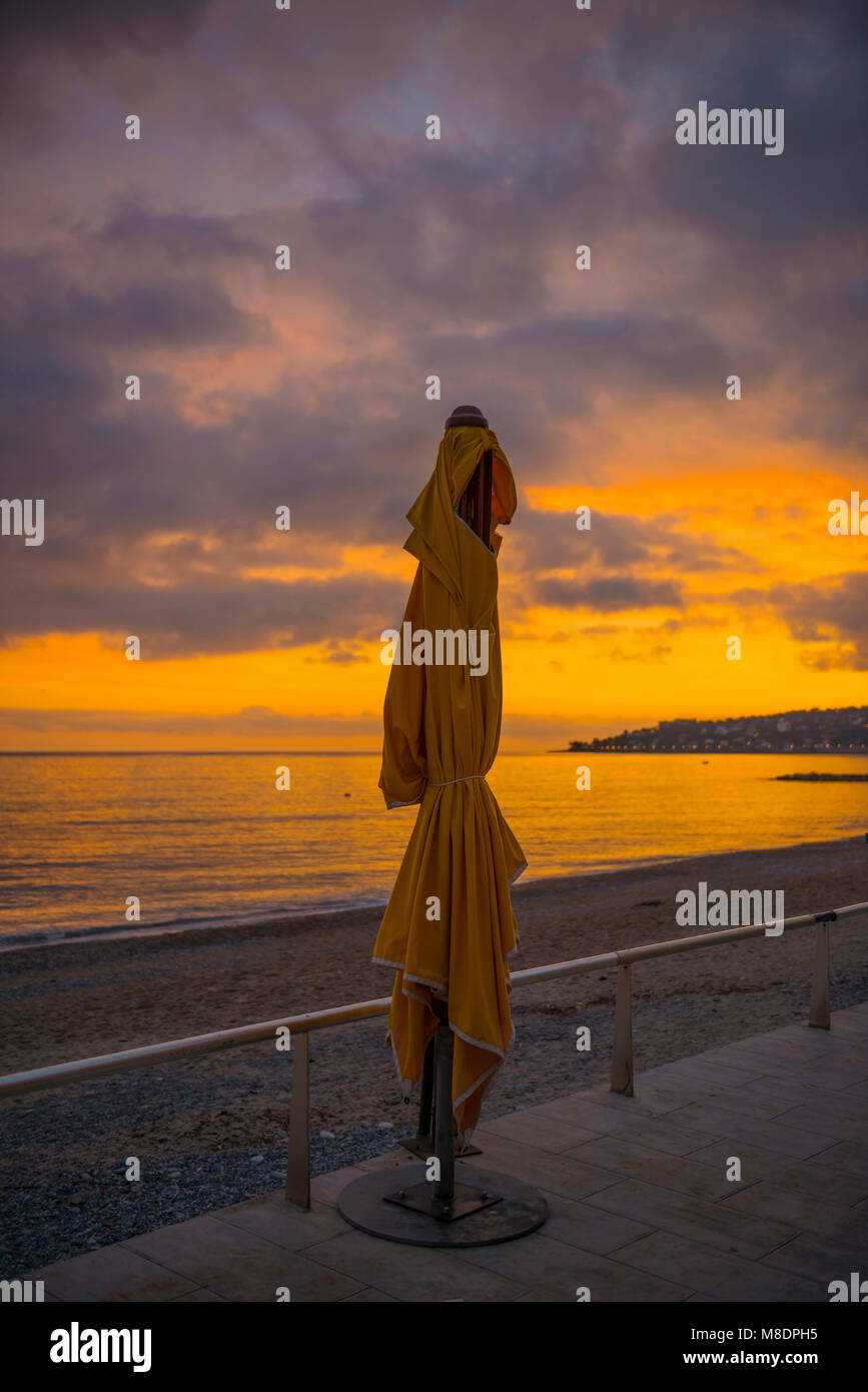 Parasol on the Beach in Dusk in Menton in Provence-Alpes-Côte d'Azur,  France Stock Photo - Alamy