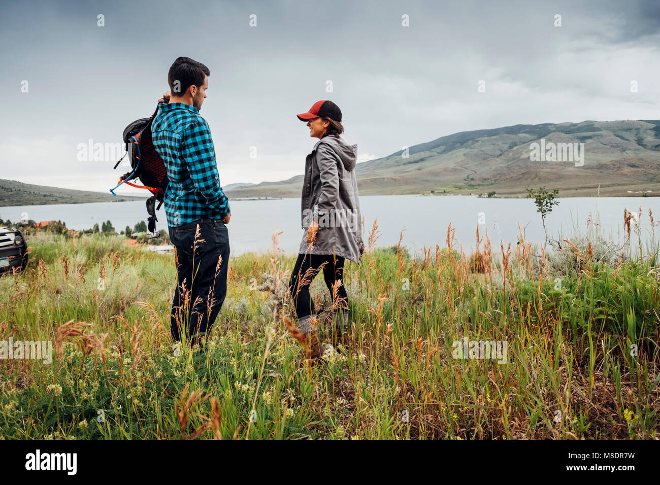 Couple standing beside Dillon Reservoir, Silverthorne, Colorado, USA Stock Photo