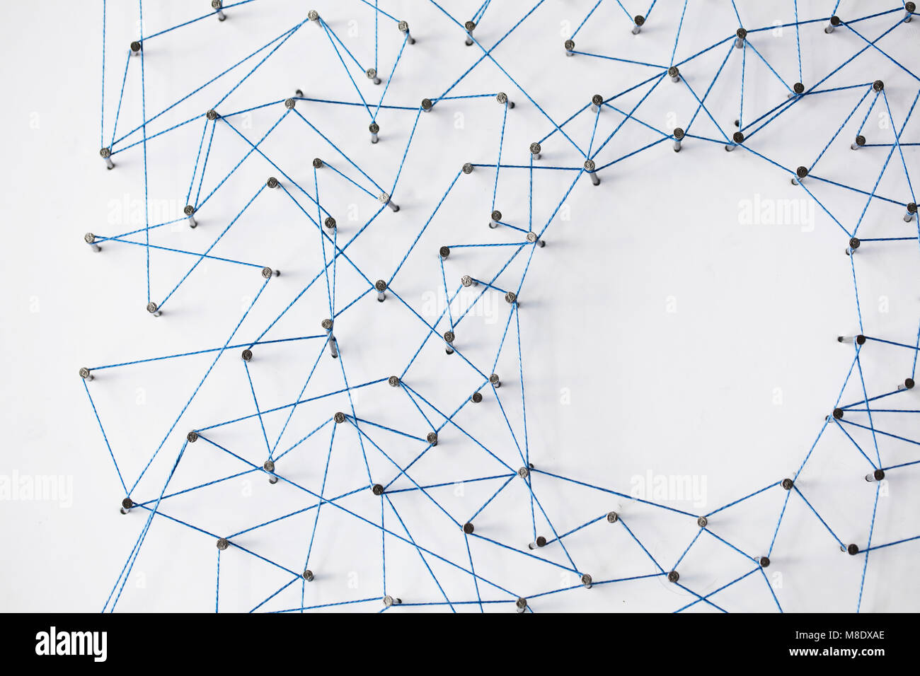 A large grid of pins connected with string. Communication, technology ...
