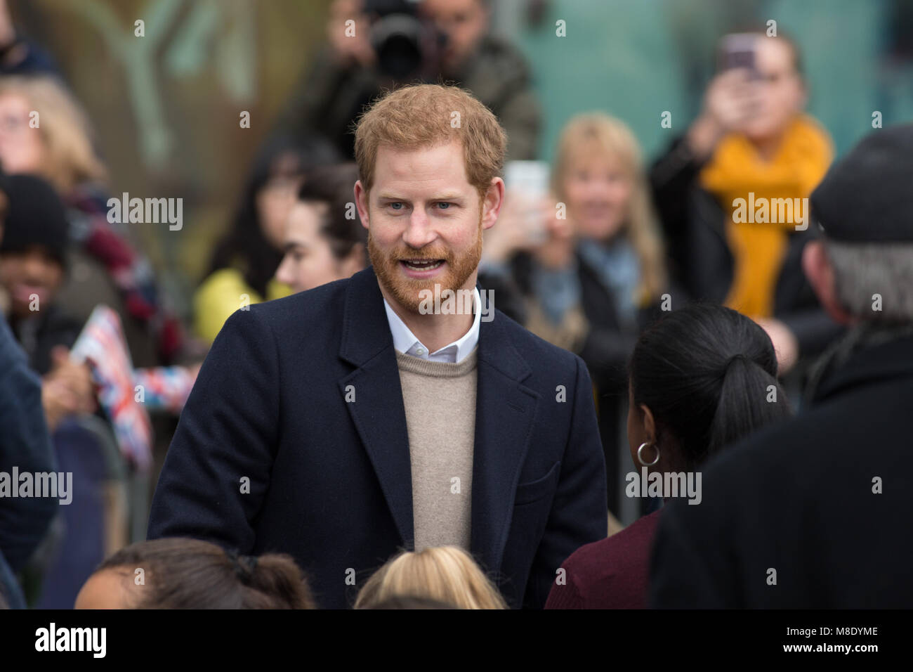 Megan Markle and Prince Harry visited Millennium Point in Birmingham on International Women's Day. Prince Harry talking to fans on arrival. Stock Photo