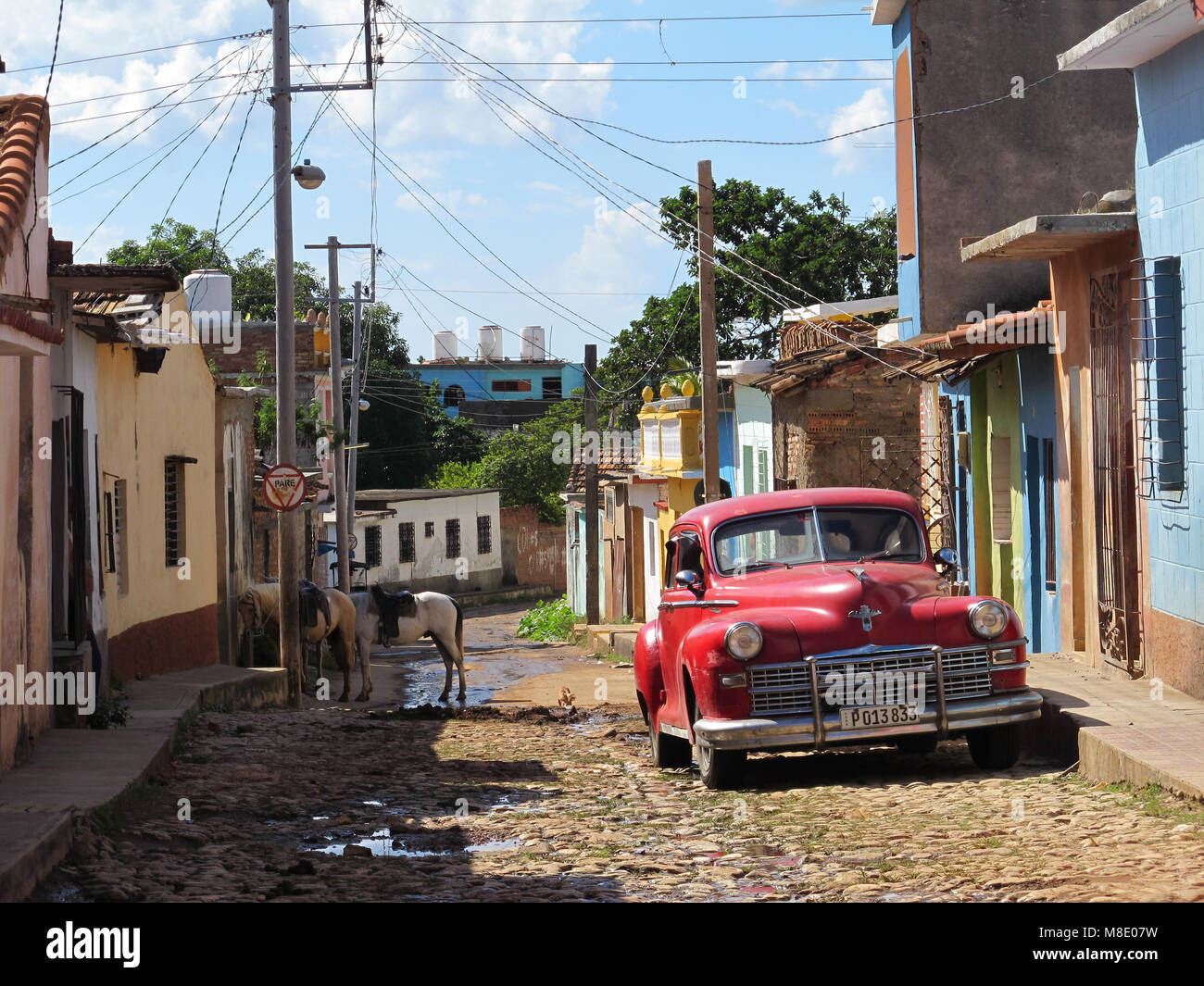 Old American car (Chrysler) at the Trinidad cobbled street. Sancti Spiritus, Cuba Stock Photo