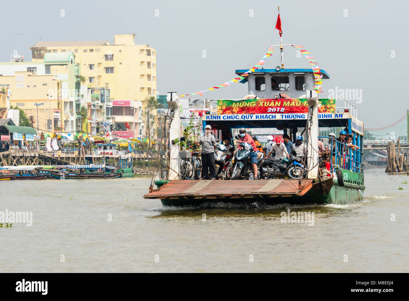 Chua Vinh Trang to Tan Long Ferry filled with people on scooters, Meekong Delta, Vietnam Stock Photo