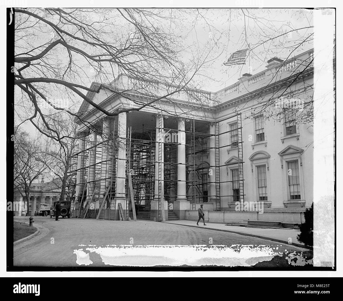 This photograph shows workers painting the White House on April 4, 1924 ...