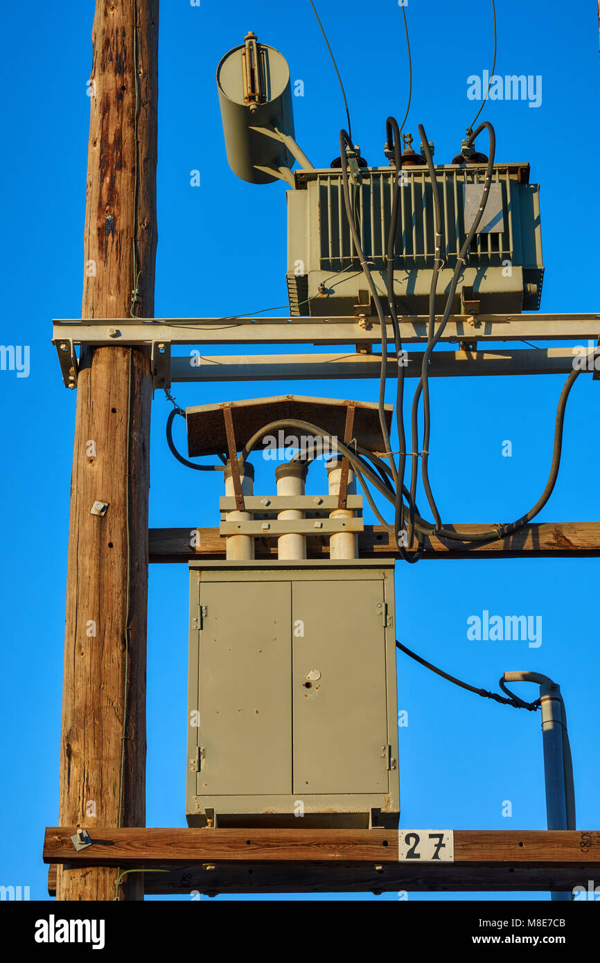 Wooden Electric Poles With Transformers At Sunset Stock Photo Alamy