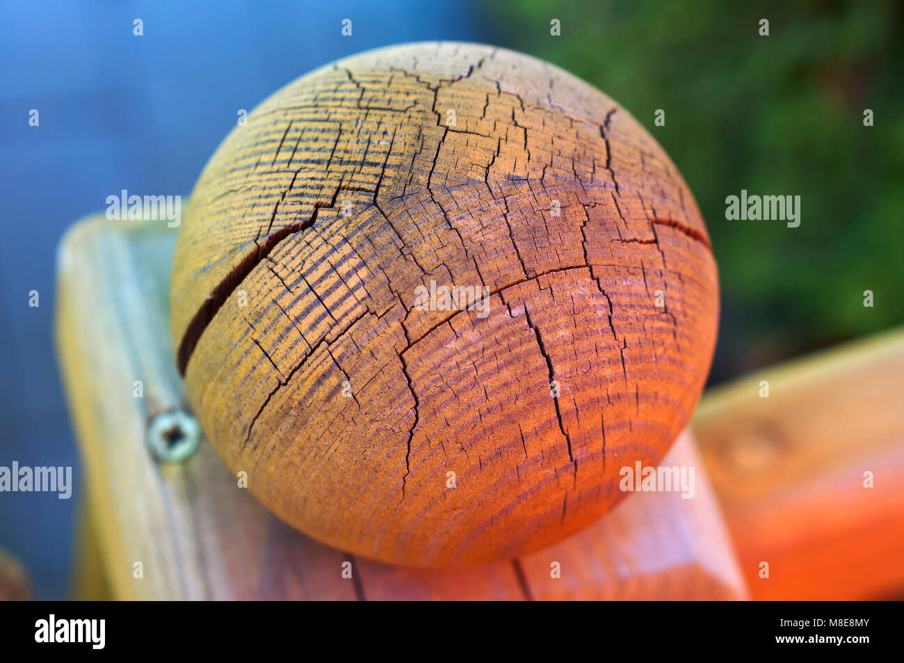 the ball is made of solid wood, cracked wood bead, round tip stair railing, ball with a crack of wood Stock Photo