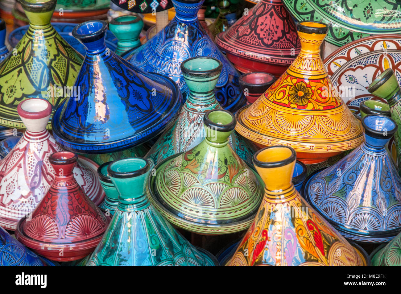 Decorative ceramic tagines on display in a pottery shop in the souks just off the Jemaa el-Fna square in Marrakesh, Morocco. Stock Photo