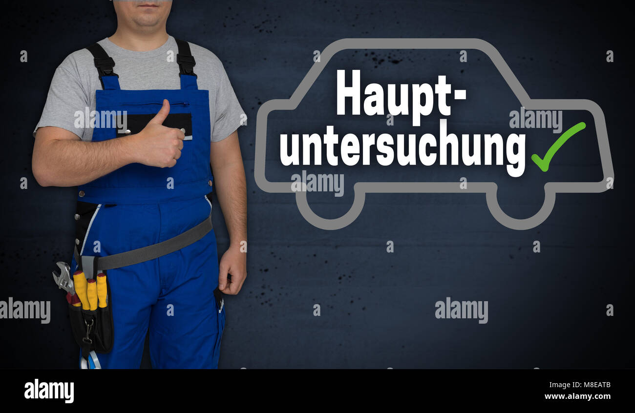 Hauptuntersuchung (in german general inspection) car and craftsman with thumbs up. Stock Photo