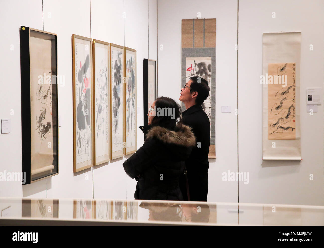 New York, USA. 16th Mar, 2018. Visitors look at artworks of Chinese artist Qi Baishi during the public viewing of Christie's Asian Art Week in New York, the United States, on March 16, 2018. Christie's on Friday kicked off its Asian Art Week, a series of auctions, viewings, and events, from March 16 to March 23. This season presents six distinct auctions including Fine Chinese Ceramics and Works of Art, South Asian Modern   Contemporary Art, etc. Credit: Wang Ying/Xinhua/Alamy Live News Stock Photo