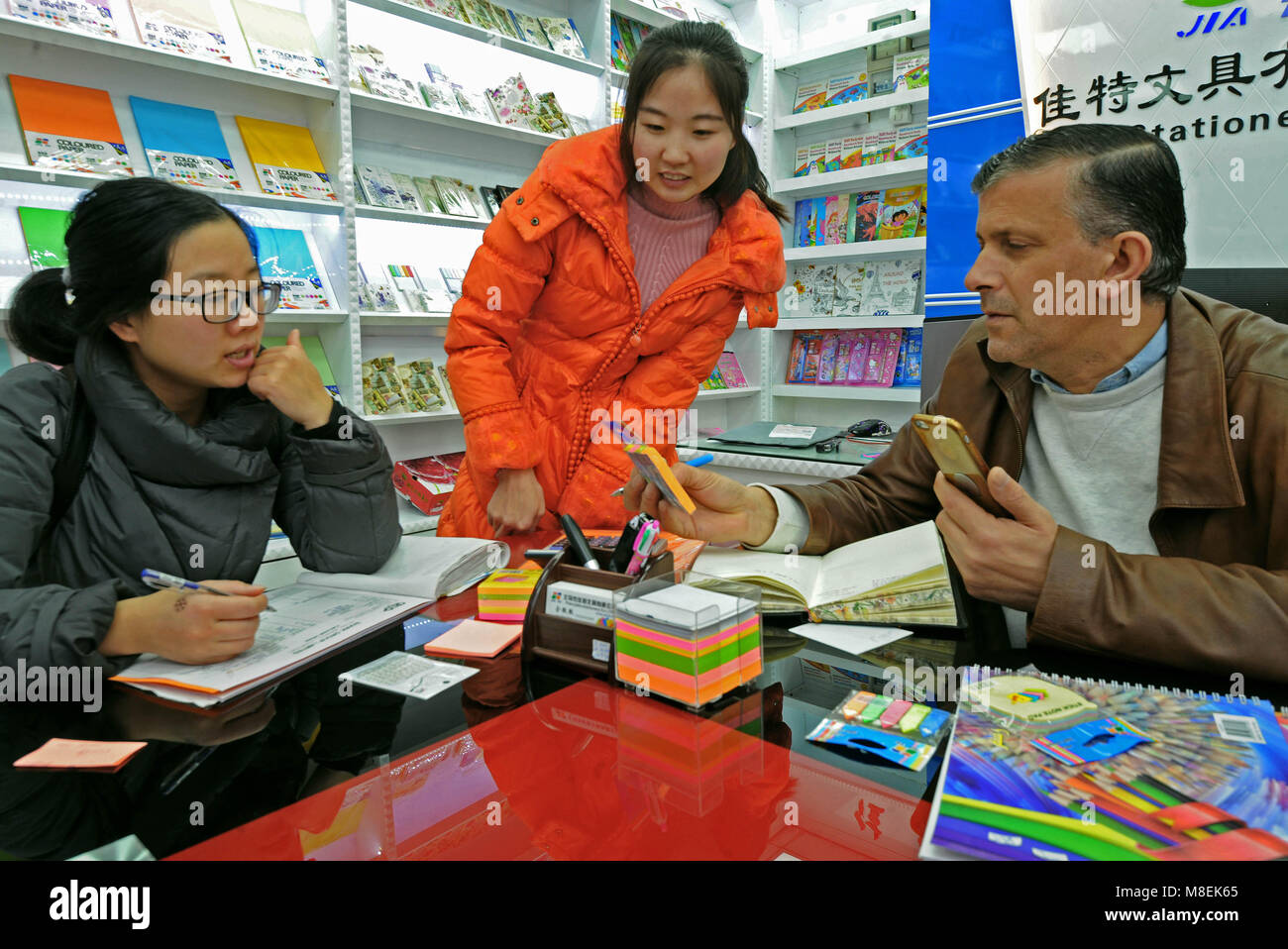 (180317) -- YIWU, March 17, 2018 (Xinhua) -- Pakistani businessman Yousef Hamurerwi (1t R) selects stationeries at the international shopping mall in Yiwu, a city specialized in small goods trade in east China's Zhejiang Province, Jan. 3, 2018. Zhejiang's trade with countries and regions related to China's Belt and Road Initiative reached 149.89 billion yuan (23.68 billion U.S. dollars) in the first two months of 2018, growing 37.3 percent year on year and accounting for 11.9 percent of China's total, according to the latest figures issued by the Hangzhou Customs. (Xinhua/Tan Jin) (ry) Stock Photo