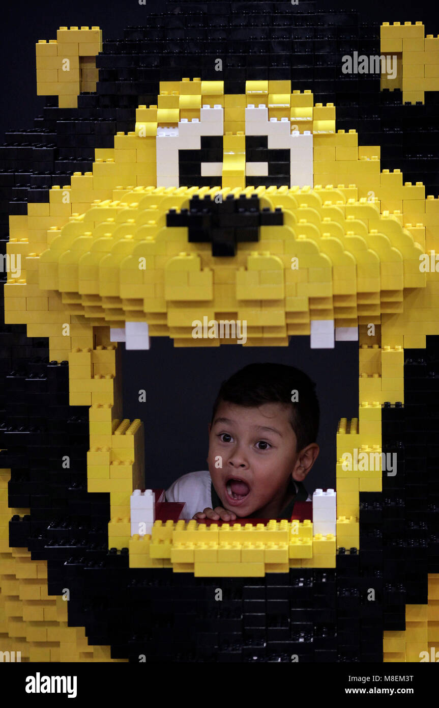 Bogota, Colombia. 16th Mar, 2018. A boy plays with one of the displayed figures during the LEGO Fun Fest 2018, in Bogota, Colombia, on March 16, 2018. Credit: Jhon Paz/Xinhua/Alamy Live News Stock Photo