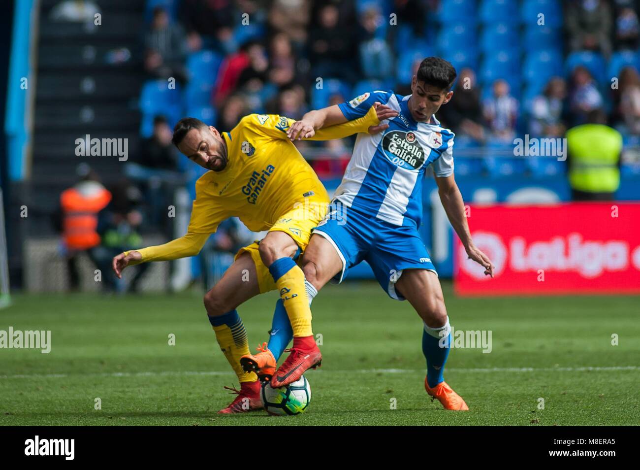 Juanfran Moreno of Deportivo and Momo of Las Palmas in action during  Santander League (La Liga) match played in Riazor Abanca Stadium between  Deportivo and Las Palmas in La Coruna, Spain, at