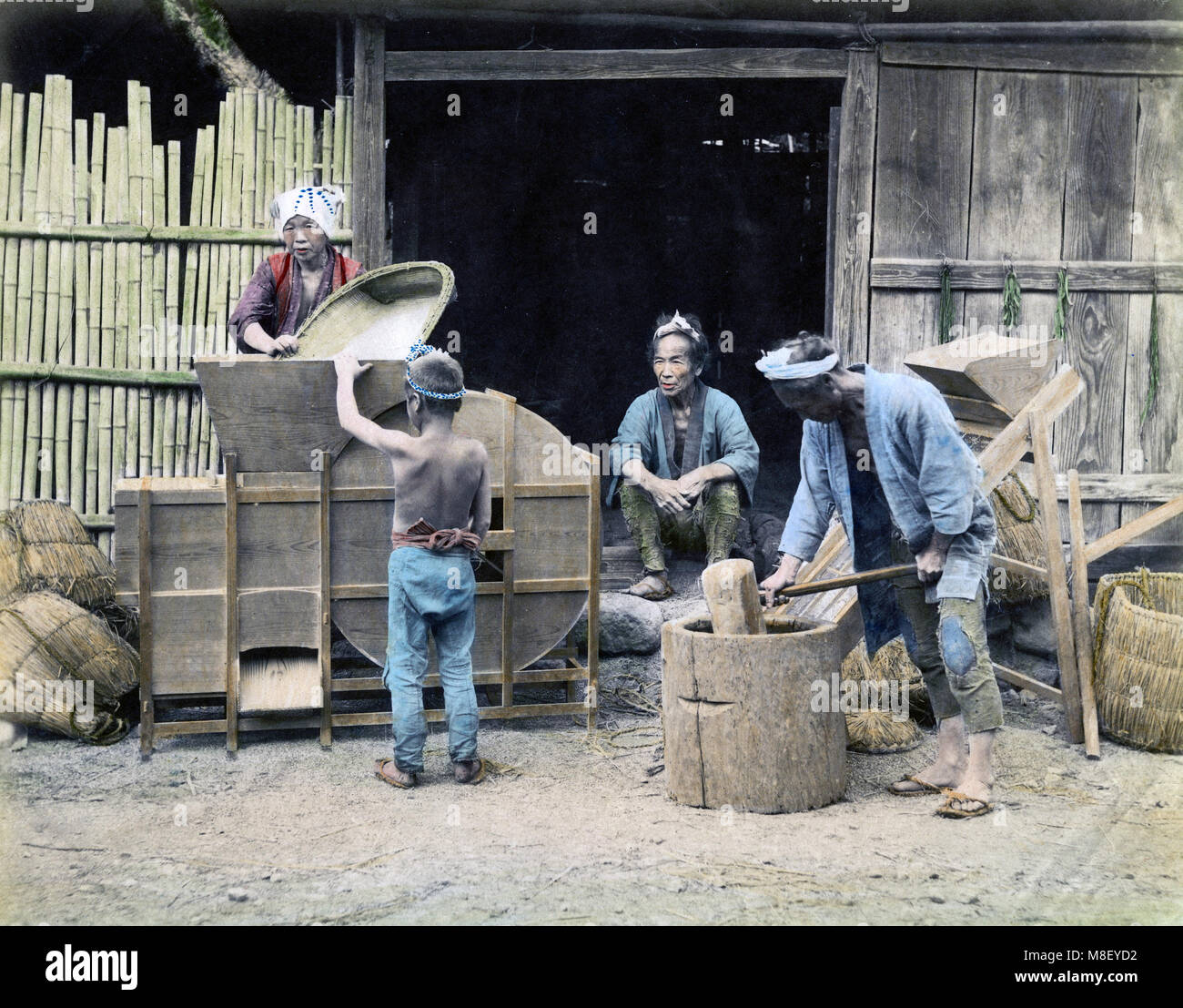 c.1880s Japan - cleaning and pounding rice Stock Photo