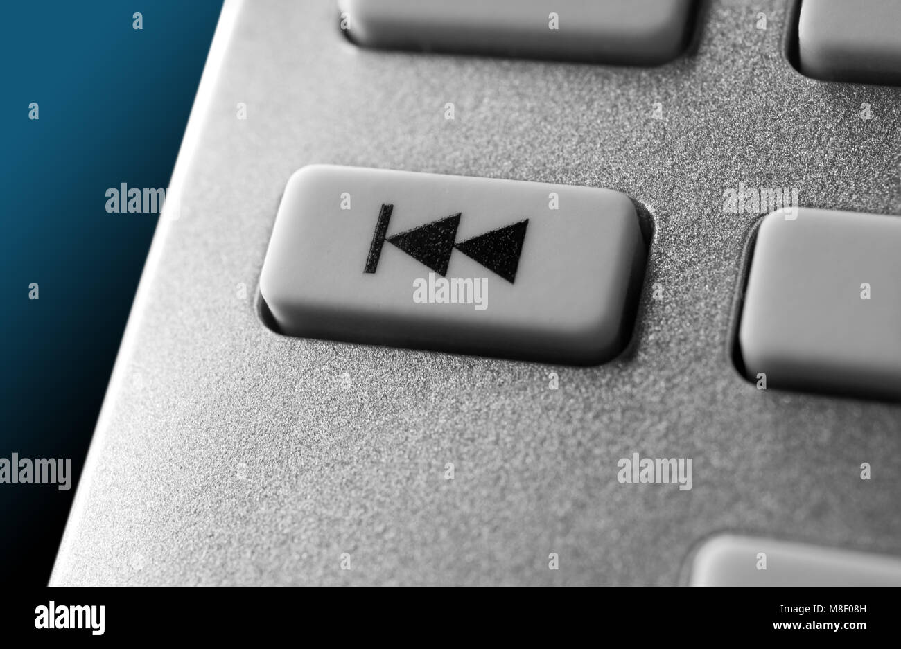 Macro Of A Grey Skip Backward Button On Chrome Remote Control For A ...