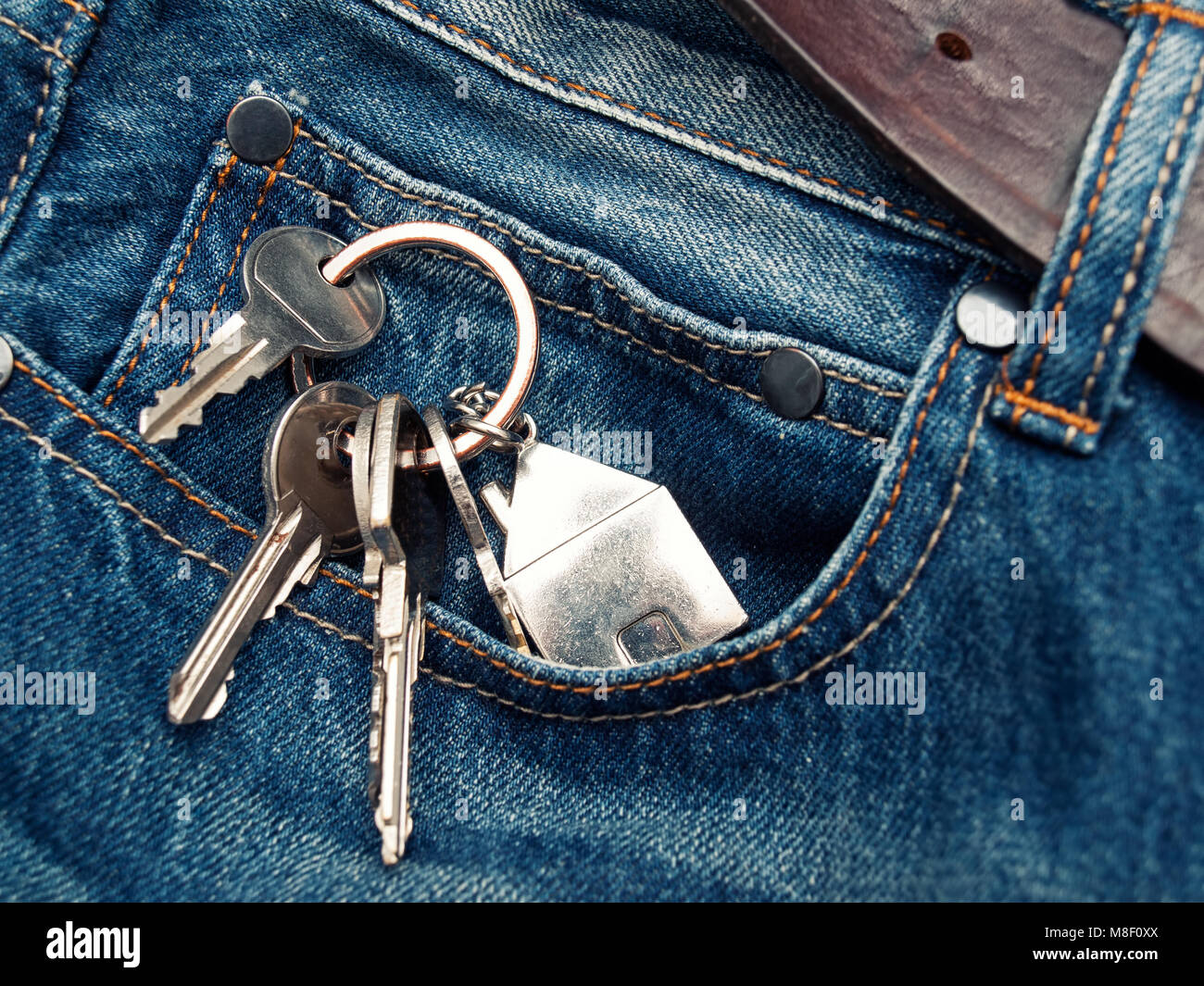 House keys in the jeans pocket Stock Photo Alamy