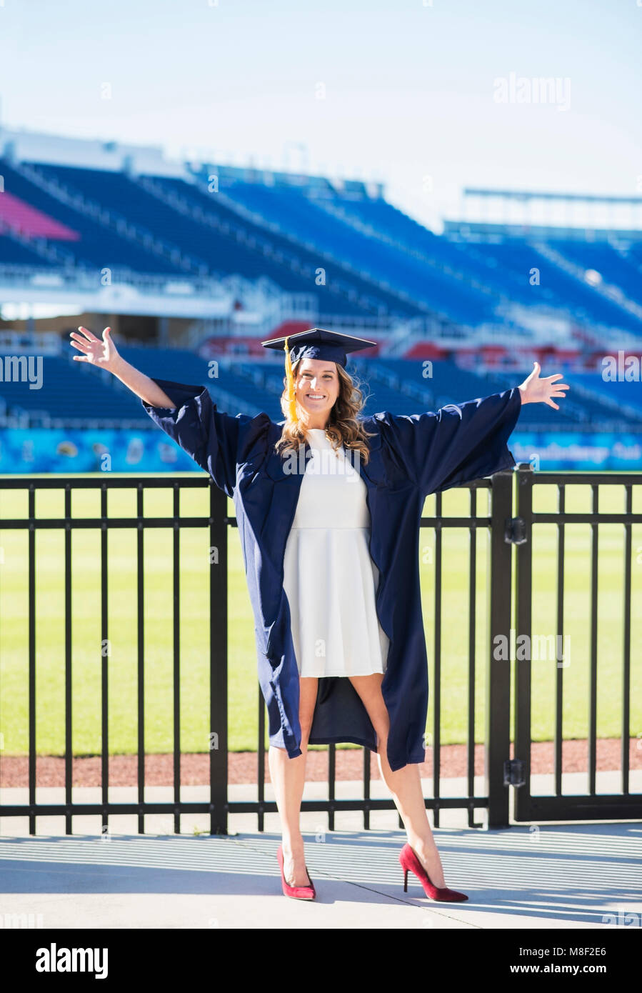 Portrait of graduate student in stadium Stock Photo