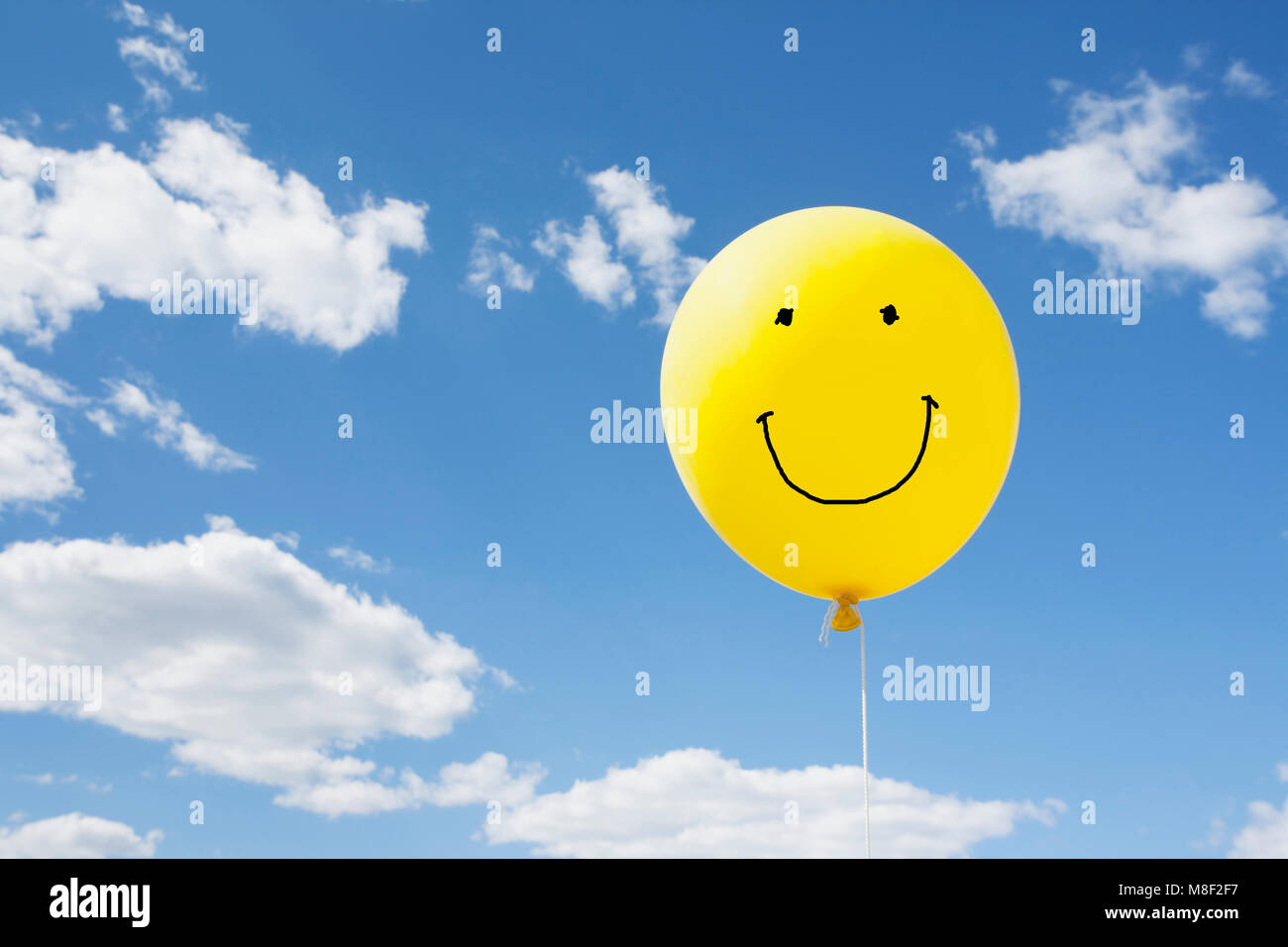 Yellow balloon in blue sky Stock Photo Alamy