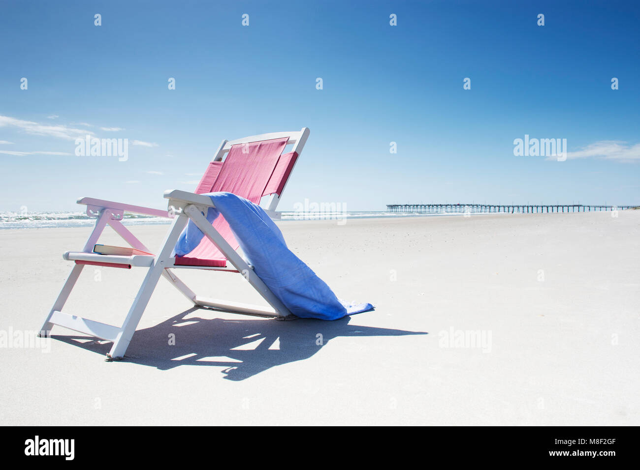 Deck chair with towel on sandy beach by Atlantic Ocean Stock Photo Alamy