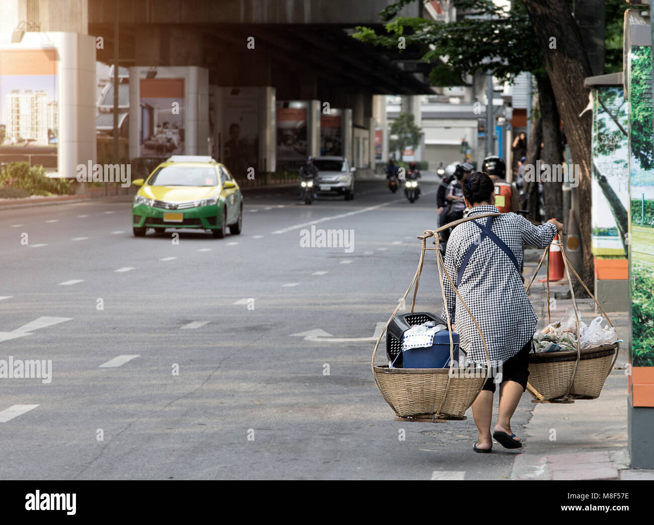 old woman hanking basket food sell on street of Bangkok Thailand Stock Photo
