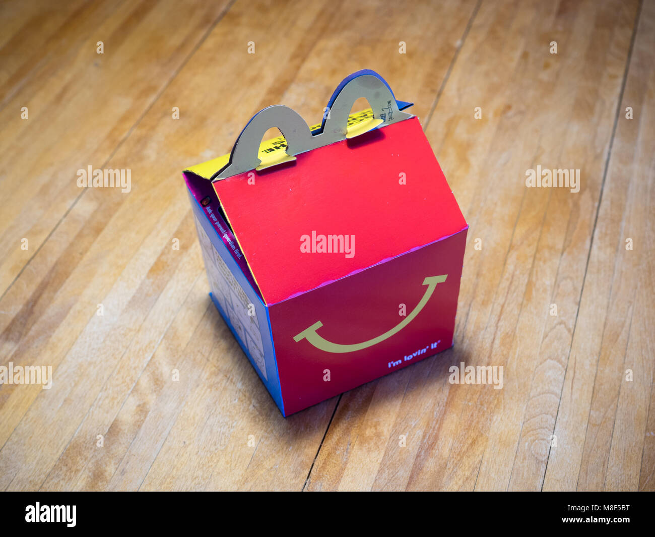 A McDonald's Happy Meal box. Stock Photo