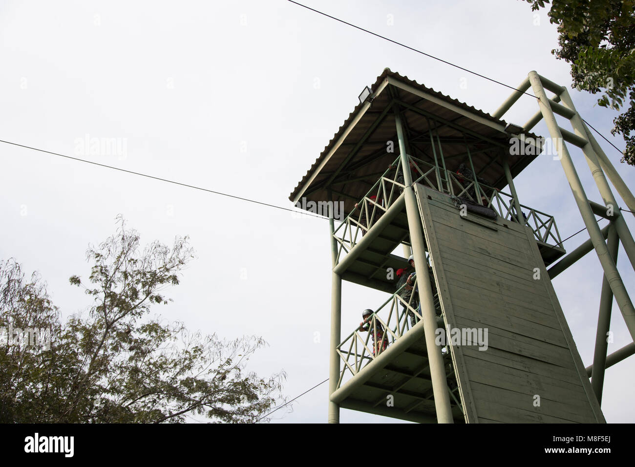 13 January 2018,Nakornrachasima,Thailand. soldier jumping cable tower outdoor activities for practice parachute Stock Photo