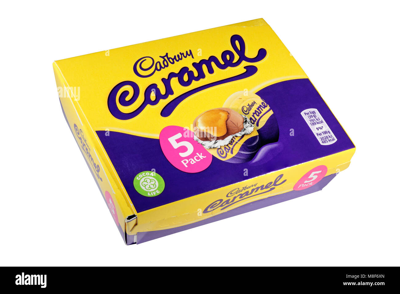 A box of 5 Cadburys Caramel Eggs with two loose isolated on a white background Stock Photo
