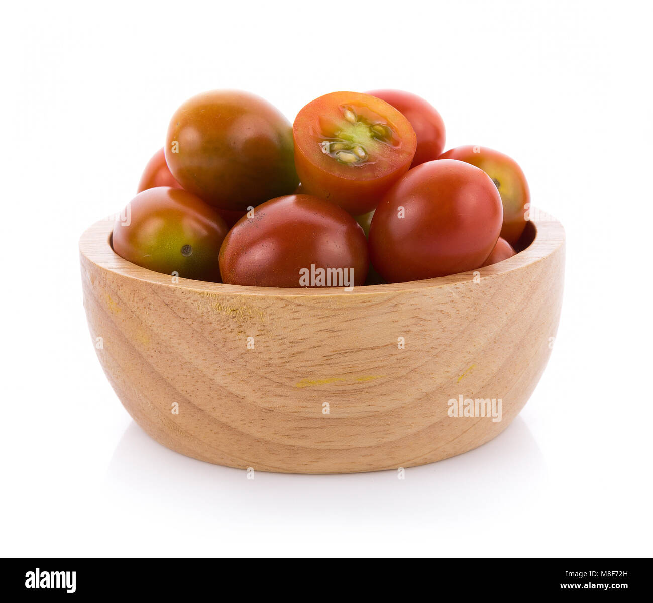 tomato in wooden bowl on white background Stock Photo - Alamy