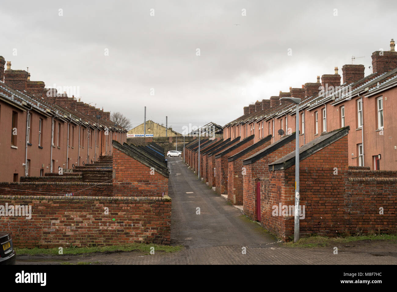 The back lane of Howick Terrace, two rows of terraced houses in Tweedmouth, Northumberland, England, UK Stock Photo