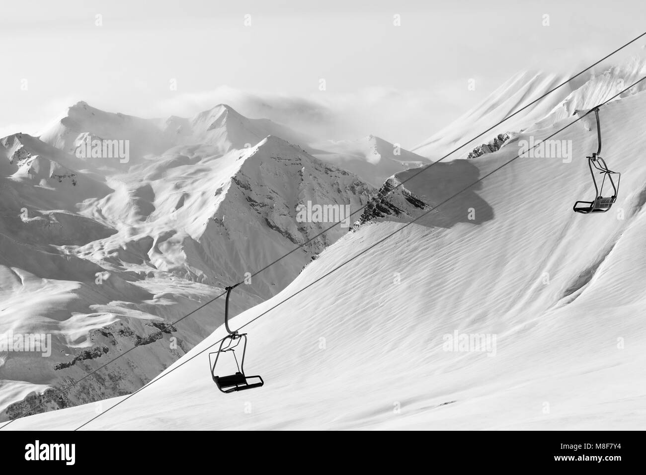 Chair lift at ski resort at winter day. Caucasus Mountains,