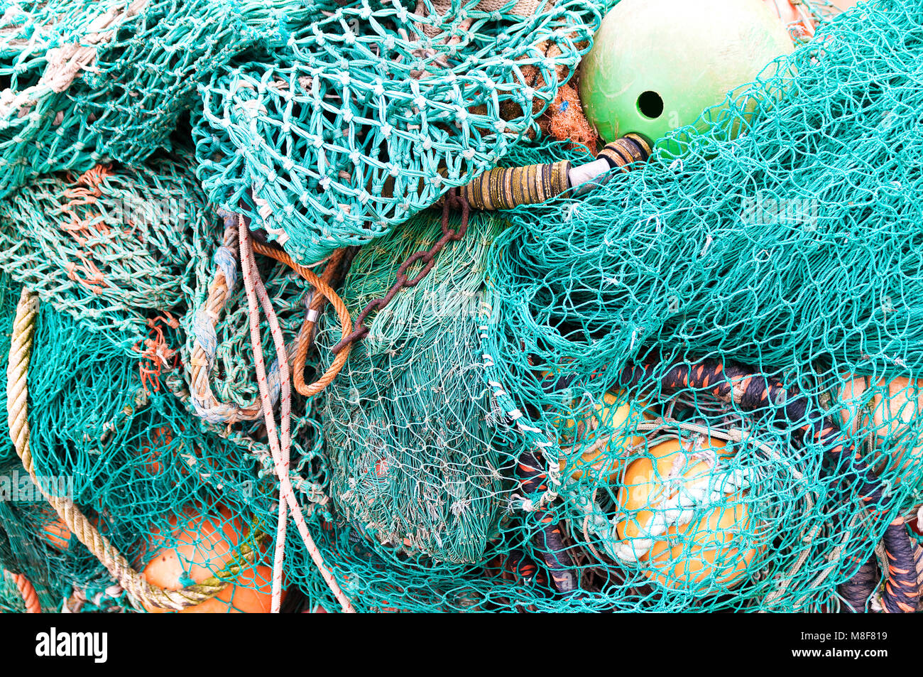 colourful fishing nets and buoys together Stock Photo Alamy