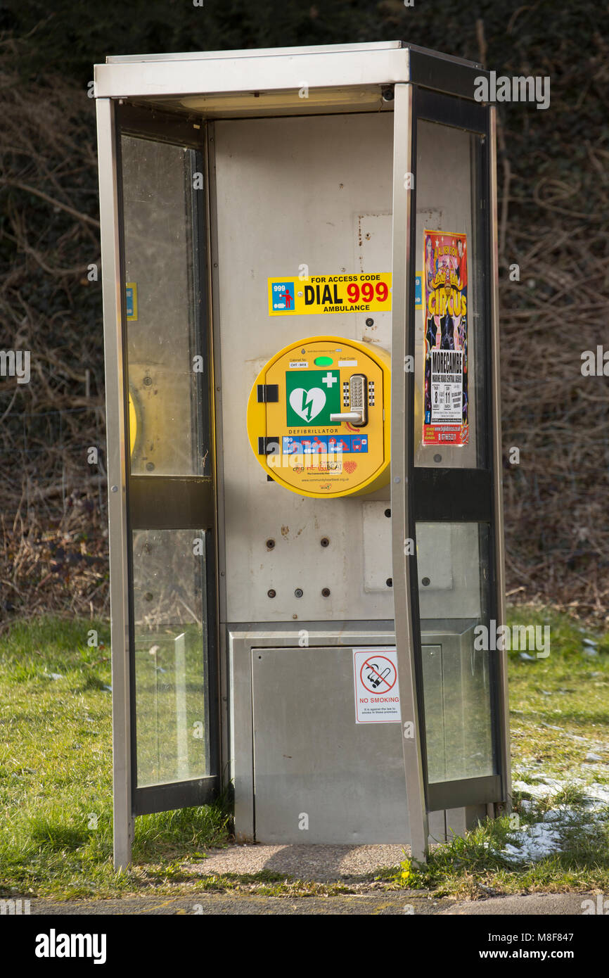 Defibrillator housed in an old telephone box, Carnforth Lancashire UK Stock Photo