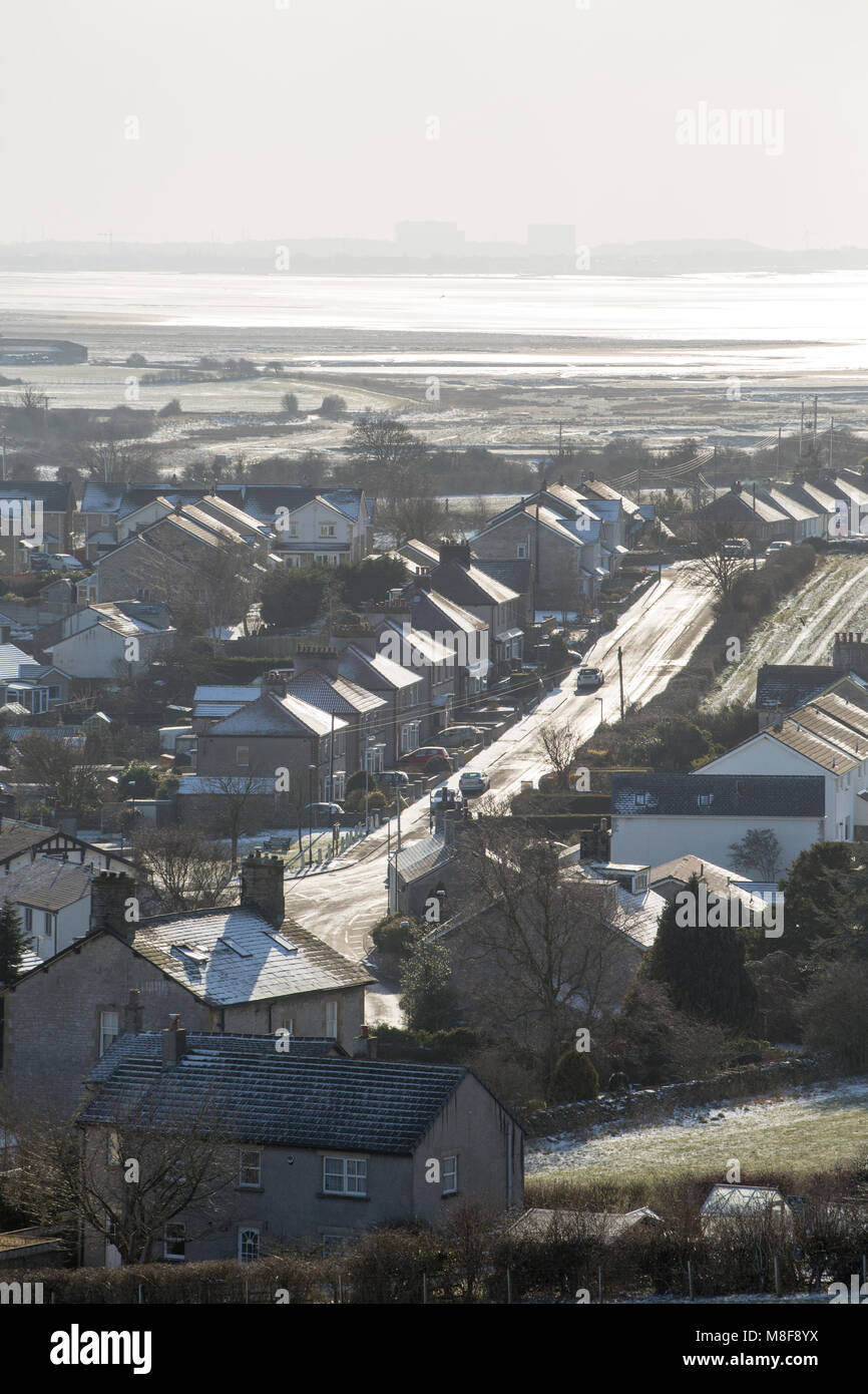 Housing on the outskirts of Warton, Lancashire Uk during the beast from the east freezing weather. Heysham power station in the background Stock Photo
