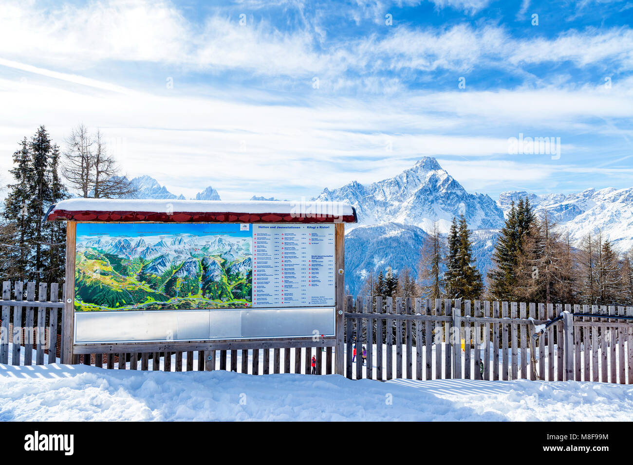 Information sign and map of the Dolomiti with Trentino Alto Adige's peaks in the background, San Candido. Italy Stock Photo
