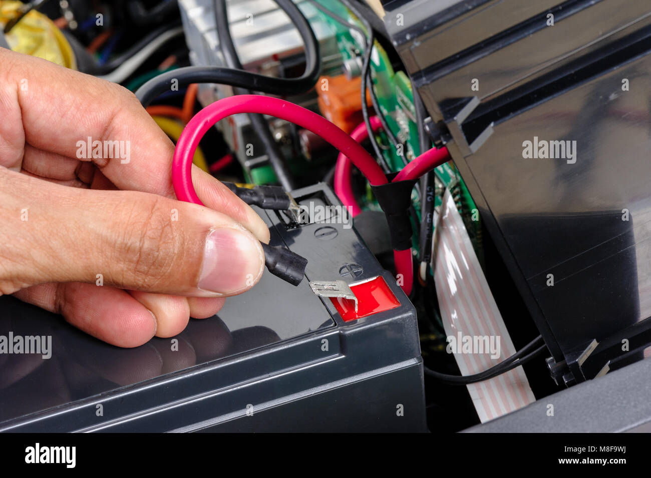 Technician replacing the UPS(Uninterruptible Power Supply) battery Stock Photo Alamy