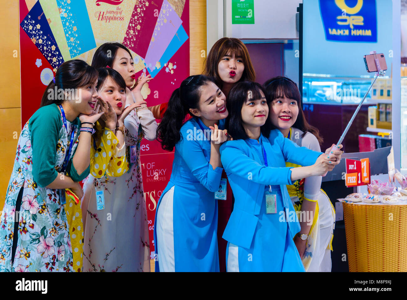 Young Women Wearing Traditional Vietnamese Take A Selfie To Celebrate Chinese Lunar New Year Ho Chi Minh International Airport Ho Chi Minh City Vietnam Stock Photo Alamy
