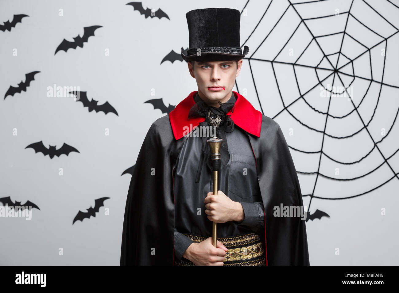 Vampire Halloween Concept Portrait of handsome caucasian Vampire in