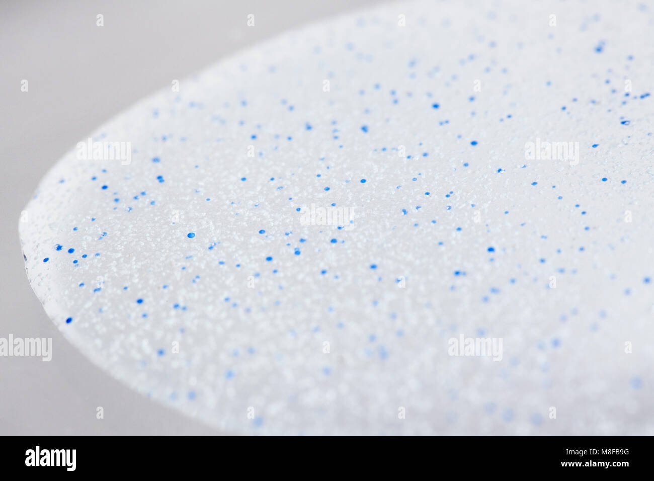 Microbeads microplastic close-up in a cosmetic face scrub Stock Photo