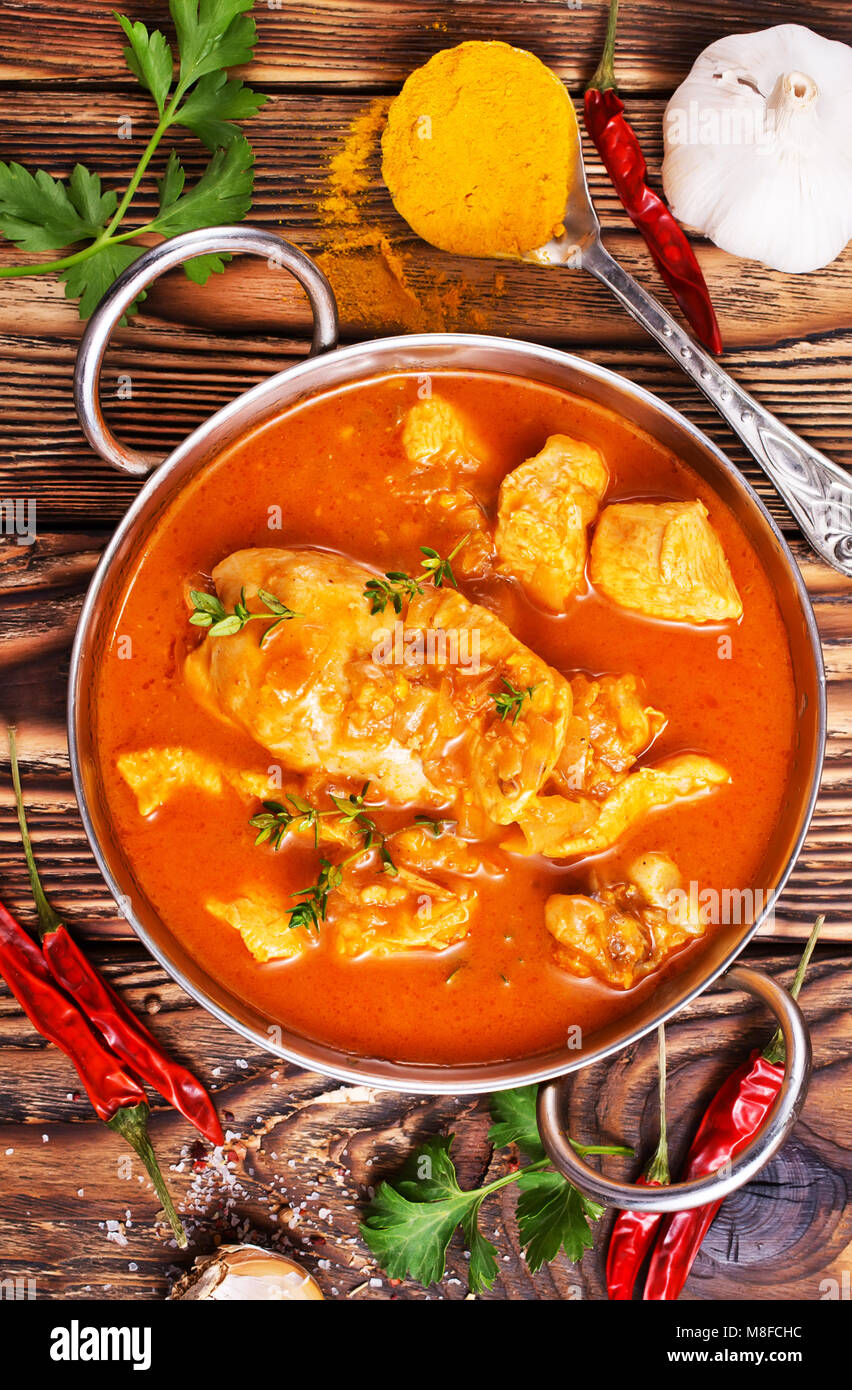 Traditional Indian dish chicken. Spicy chicken curry in bowl Stock