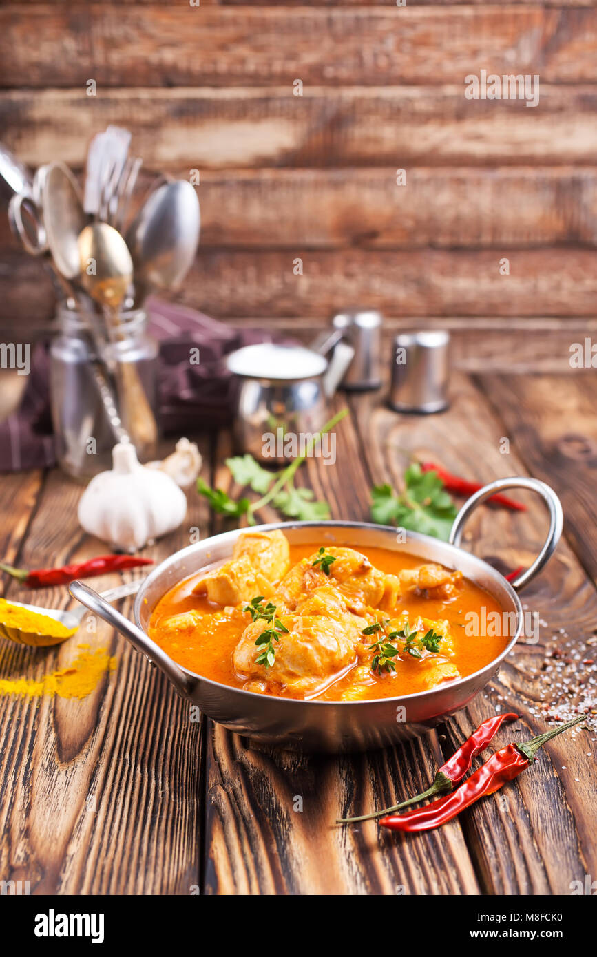 Traditional Indian dish chicken. Spicy chicken curry in bowl Stock