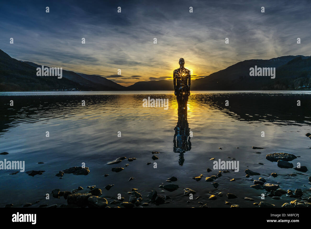 The 'Mirror Man', St Fillans, Perthshire. 'Still' sculpture on Loch Earn by Rob Mulholland. Stock Photo