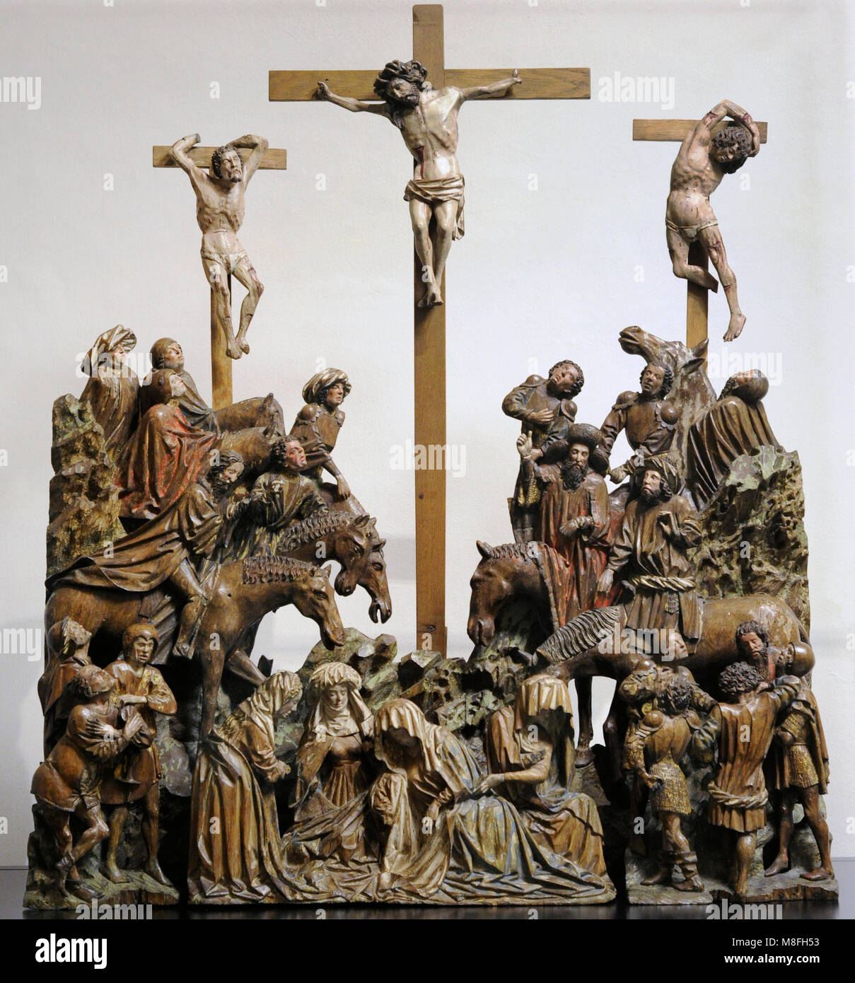 Crucifixion (Calvary). Sculptural group. Southern Netherlands, c. 1430-1440. Oak, polychrome. Schnütgen Museum. Cologne, Germany. Stock Photo