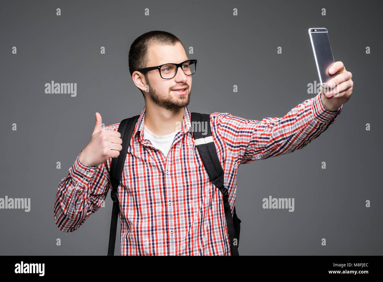 Happy Young Man Taking Self Portrait Photography Through Smart Phone