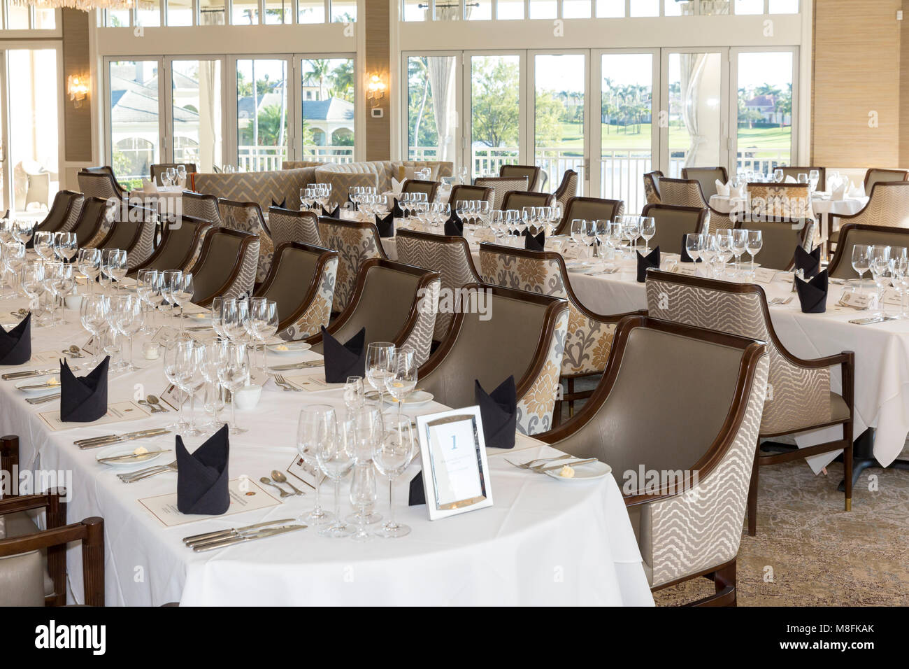 Banquet tables and place settings for formal wine club dinner, Naples, Florida, USA Stock Photo