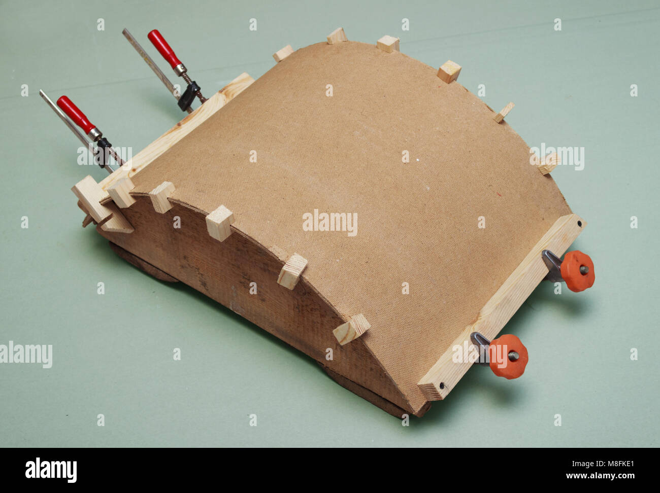 Gluing the workpiece of hardboard on the template Stock Photo Alamy