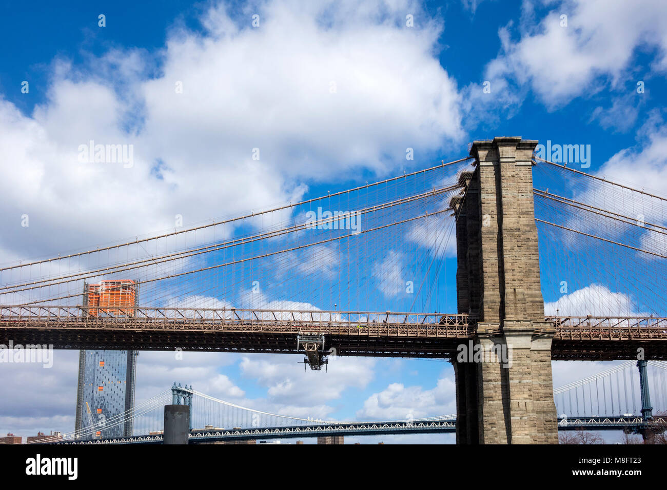 Brooklyn Bridge with new skyscraper under construction Stock Photo - Alamy