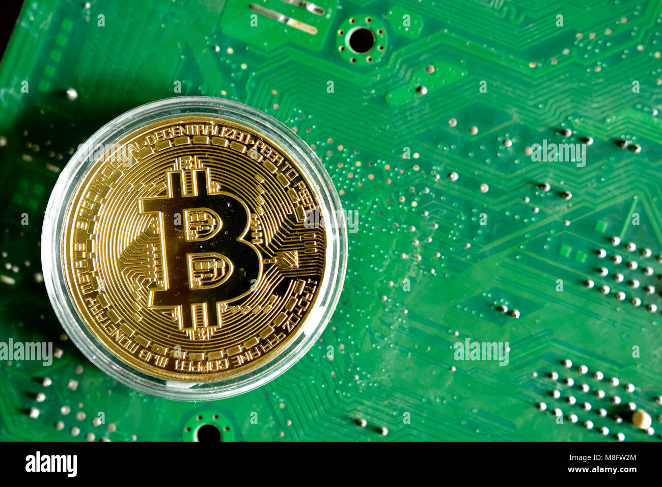 Bitcoin on computer motherboard circuit background Stock Photo - Alamy